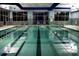 Indoor pool with clear water and plentiful lighting at 31470 Royal Tern Ln, Indian Land, SC 29707