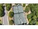 Overhead view of community tennis courts with well maintained green surfaces and surrounding mature trees at 31470 Royal Tern Ln, Indian Land, SC 29707