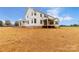 Spacious backyard with a covered patio perfect for outdoor entertaining and relaxation at 4095 Kingfisher Dr, York, SC 29745