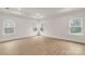 Light-filled bedroom with large windows and light wood floors at 4095 Kingfisher Dr, York, SC 29745