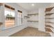 Walk-in closet with wooden shelves provides ample storage space and is well-lit by natural light at 4095 Kingfisher Dr, York, SC 29745
