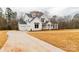 Beautiful new construction home featuring a three car garage and a spacious lawn at 4095 Kingfisher Dr, York, SC 29745