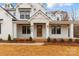 Inviting front porch of a craftsman style home with a brick foundation at 4095 Kingfisher Dr, York, SC 29745