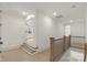 Second floor hallway, showcasing hardwood floors and staircase access to the home's other areas at 4095 Kingfisher Dr, York, SC 29745