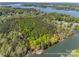 Areal view of the acreage including lake waterfront access surrounded by dense trees on this secluded lot at 4095 Kingfisher Dr, York, SC 29745