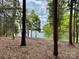Waterfront lot with a tree-lined shoreline, creating a serene and secluded atmosphere perfect for building at 4095 Kingfisher Dr, York, SC 29745