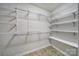 Spacious walk-in closet with white shelving and rods for ample storage and organization at 5009 Ravens Ct, Matthews, NC 28104