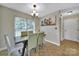 Charming dining room with a modern chandelier and large window at 5009 Ravens Ct, Matthews, NC 28104