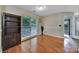 Cozy dining room with hardwood floors, built-in shelving, and natural light at 5009 Ravens Ct, Matthews, NC 28104