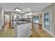 Bright kitchen with an island, stainless steel appliances, and access to the dining area at 5009 Ravens Ct, Matthews, NC 28104