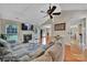 Spacious living room with fireplace, vaulted ceiling, and ample natural light at 5009 Ravens Ct, Matthews, NC 28104
