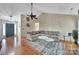 Bright living room showcasing a large sectional sofa and modern decor at 5009 Ravens Ct, Matthews, NC 28104