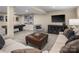 A spacious, carpeted basement featuring a large sectional sofa, and modern decor at 522 Lenswood Ct, Denver, NC 28037