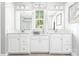 Elegant bathroom featuring dual vanities, white cabinetry, and modern fixtures at 522 Lenswood Ct, Denver, NC 28037