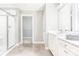 Bright bathroom with walk-in shower, white vanity, and tile flooring at 522 Lenswood Ct, Denver, NC 28037