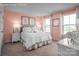 A beautifully decorated bedroom with soft colors, a comfortable bed and bright natural lighting at 522 Lenswood Ct, Denver, NC 28037