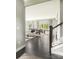 Open-concept living and dining area with hardwood floors, stylish furniture, and natural light at 522 Lenswood Ct, Denver, NC 28037