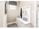 A mudroom with built-in bench and storage cabinets, complemented by modern design at 522 Lenswood Ct, Denver, NC 28037