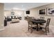Spacious finished basement with a seating area, television, and dining space perfect for entertaining at 521 Lenswood Ct, Denver, NC 28037