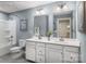 The primary bathroom features a double vanity and a shower-tub combo with modern fixtures at 523 Lenswood Ct, Denver, NC 28037