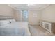 Bedroom featuring neutral tones, carpet, ceiling fan, and large window at 5400 Challisford Ln, Charlotte, NC 28226