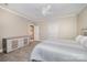 Neutral bedroom featuring carpet, ceiling fan, and view into ensuite bathroom at 5400 Challisford Ln, Charlotte, NC 28226