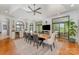 Elegant dining area featuring a wooden table, modern chairs, and views to the outdoors at 5400 Challisford Ln, Charlotte, NC 28226