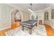 Entertainment area with a pool table, hardwood floors, and archways at 5400 Challisford Ln, Charlotte, NC 28226