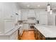 Charming kitchen with white cabinets, a stainless steel range, and a marble island at 5400 Challisford Ln, Charlotte, NC 28226