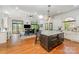 Spacious open-concept kitchen with an island, dining area, and lots of natural light at 5400 Challisford Ln, Charlotte, NC 28226