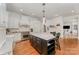 Modern kitchen featuring a large island, stainless steel appliances, and white cabinetry at 5400 Challisford Ln, Charlotte, NC 28226