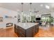 Bright kitchen featuring a marble island, white cabinetry, and open layout at 5400 Challisford Ln, Charlotte, NC 28226