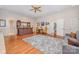 Open living room featuring a wet bar, hardwood floors, comfortable seating, and ample space at 5400 Challisford Ln, Charlotte, NC 28226