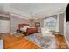 Large main bedroom with a sitting area, and hardwood floors in a home for sale at 5400 Challisford Ln, Charlotte, NC 28226