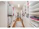 Organized walk-in closet with custom shelving, hanging rods, and plenty of storage space at 5400 Challisford Ln, Charlotte, NC 28226
