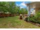 Backyard featuring a wooden fence, plants, grill, patio furniture, and a grassy yard at 544 Cool Creek Dr, Rock Hill, SC 29732
