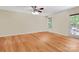 Bright bedroom with hardwood floors, a ceiling fan, and a door leading to an outdoor space at 544 Cool Creek Dr, Rock Hill, SC 29732