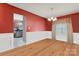 Elegant dining room with hardwood floors, wainscoting, and a chandelier, perfect for entertaining at 544 Cool Creek Dr, Rock Hill, SC 29732