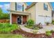 Inviting front porch with brick accents, beautiful plants, and manicured landscaping leading to a cozy entrance at 544 Cool Creek Dr, Rock Hill, SC 29732