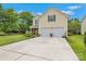 Two-story home with a large concrete driveway, two-car garage, and beautiful green shutters at 544 Cool Creek Dr, Rock Hill, SC 29732