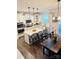 Spacious kitchen featuring white cabinets, a large center island with seating, and modern appliances at 6016 Willow Pin Ln, Huntersville, NC 28078