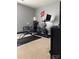 This well-equipped home gym features a stationary bike and weight training bench at 6509 Ridgeview Commons Dr, Charlotte, NC 28269
