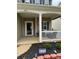 Inviting front porch with a covered entrance, offering a cozy outdoor seating area at 6509 Ridgeview Commons Dr, Charlotte, NC 28269