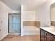 Bathroom features shower and separate soaking tub and tile floors throughout at 6541 Hasley Woods Dr, Huntersville, NC 28078