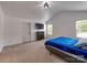 Spacious bedroom features vaulted ceiling, wall-mounted TV, and windows that bring in plenty of natural light at 6541 Hasley Woods Dr, Huntersville, NC 28078