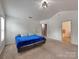 Large bedroom boasts vaulted ceiling, plush carpet, and easy access to an en-suite bathroom at 6541 Hasley Woods Dr, Huntersville, NC 28078