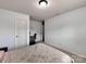 Bedroom featuring neutral walls, carpeted floors, and a functional workspace for comfortable living at 6541 Hasley Woods Dr, Huntersville, NC 28078