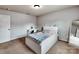 Comfortable bedroom featuring a white bed frame, a desk, carpeted floors, and a window with natural light at 6541 Hasley Woods Dr, Huntersville, NC 28078