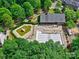 Aerial view of a community pool, kiddie pool, and recreation building with surrounding greenery at 6541 Hasley Woods Dr, Huntersville, NC 28078