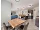 Open concept with kitchen and dining area with stylish table set perfect for entertaining at 6541 Hasley Woods Dr, Huntersville, NC 28078